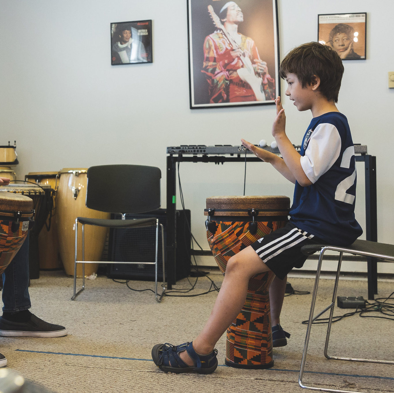 Percussion teacher and student playing drums.
