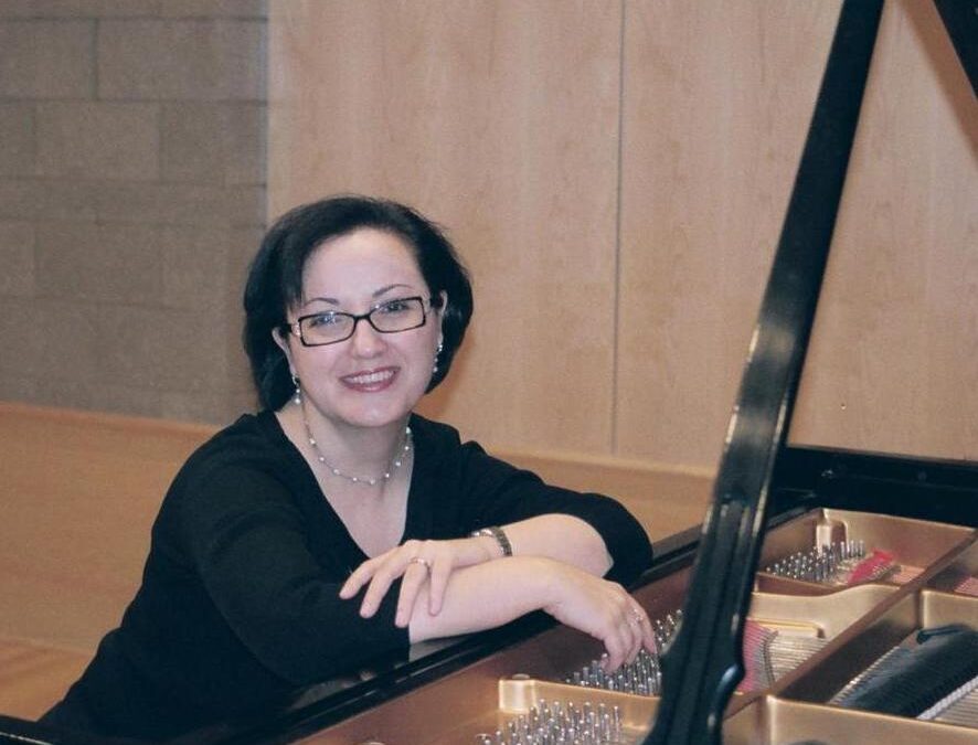Piano faculty Anna Soukiassian seated at a piano