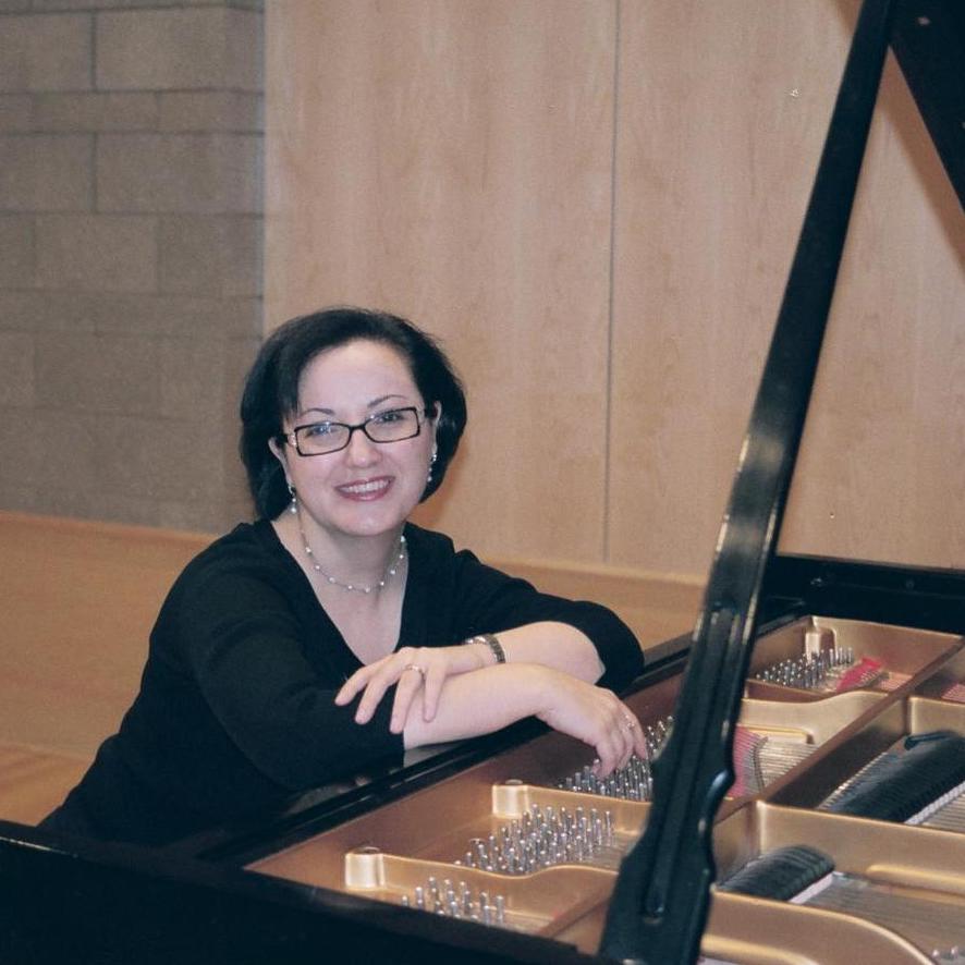 Piano faculty Anna Soukiassian seated at a piano