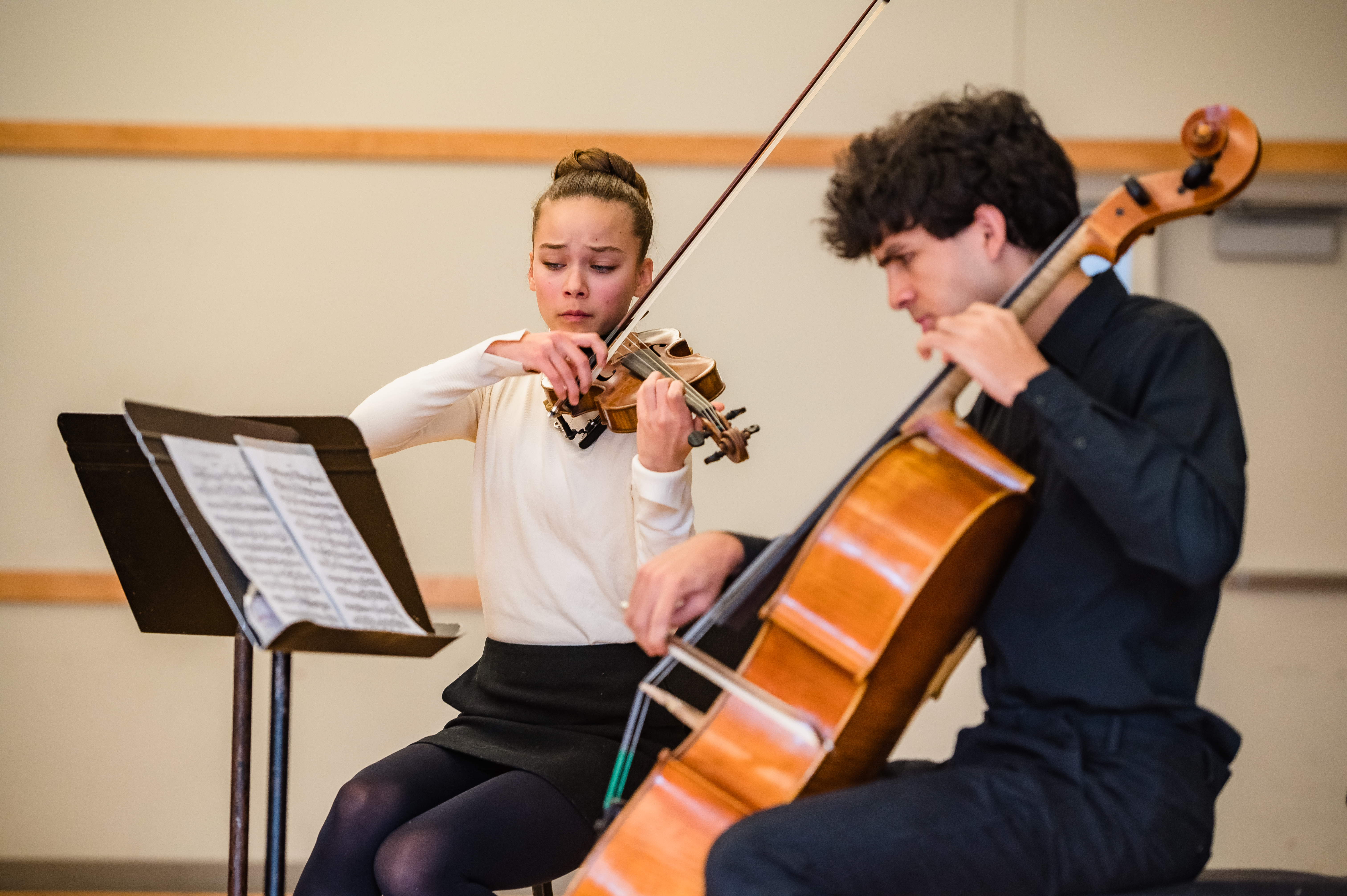 The violinist and cellist of a student piano trio.