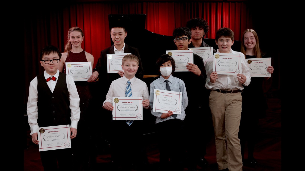 Student competition winners holding certificates