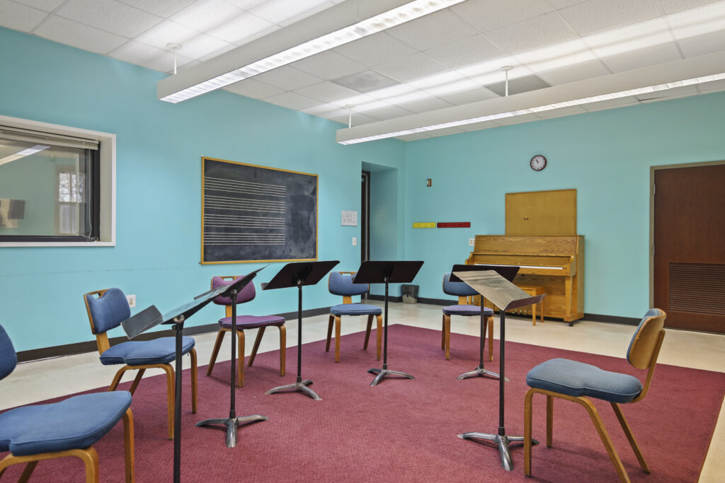 Lower Level Classroom with Chairs and Piano