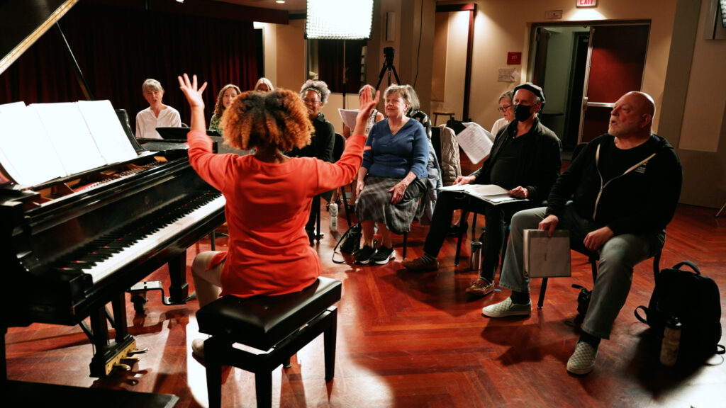 Members of Capital City Voices in rehearsal, led by Levine Music faculty member Alison Crockett.