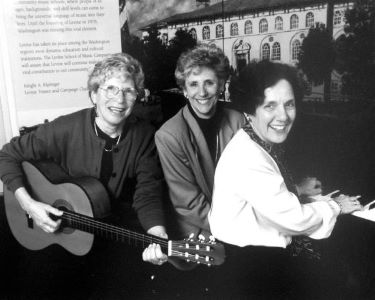 Jackie Marlin, Diana Engel, and Ruth Cogen sat at a piano