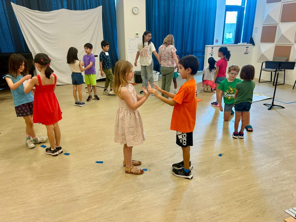 Two campers dancing together.