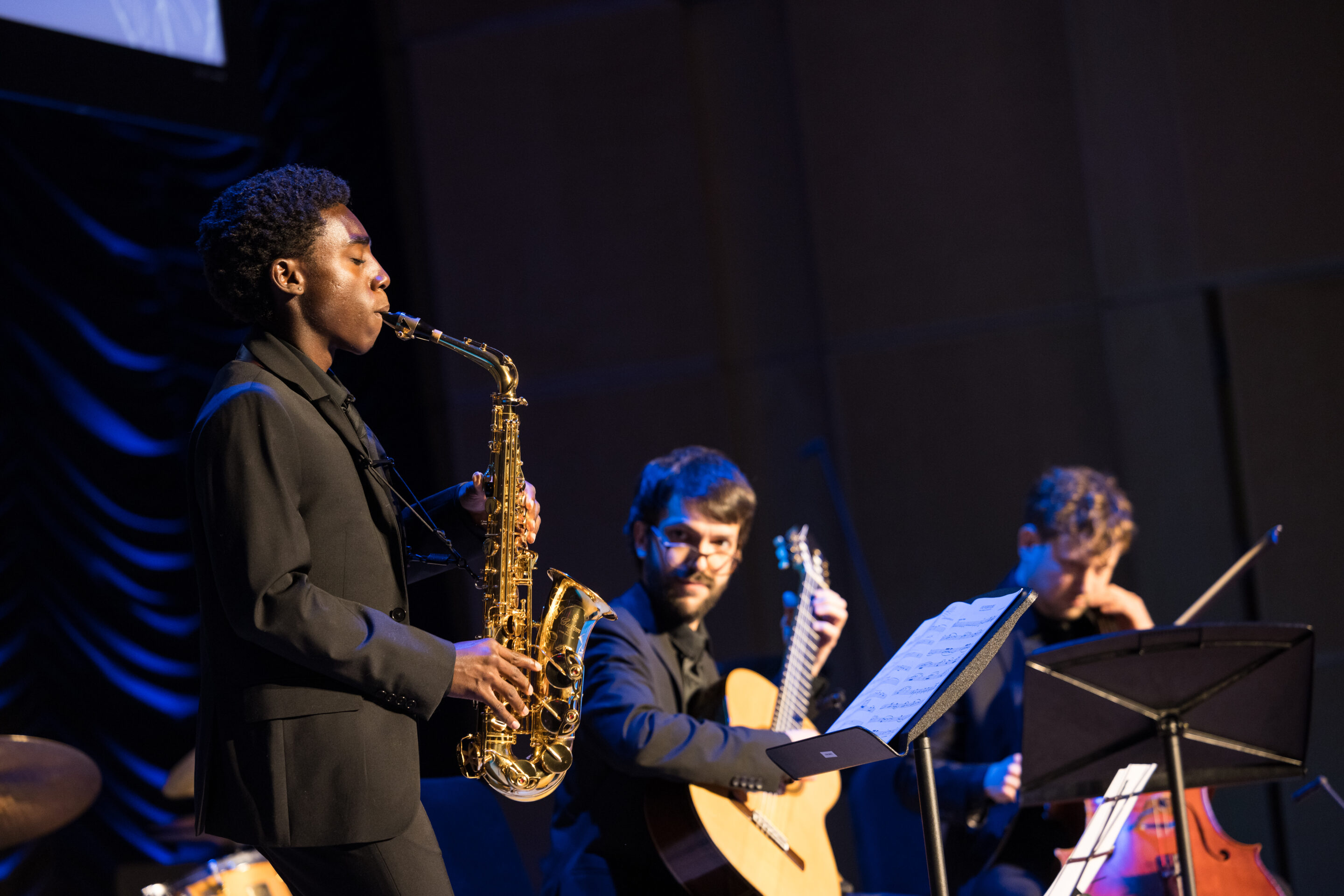 A sax student performing at the 2025 gala.
