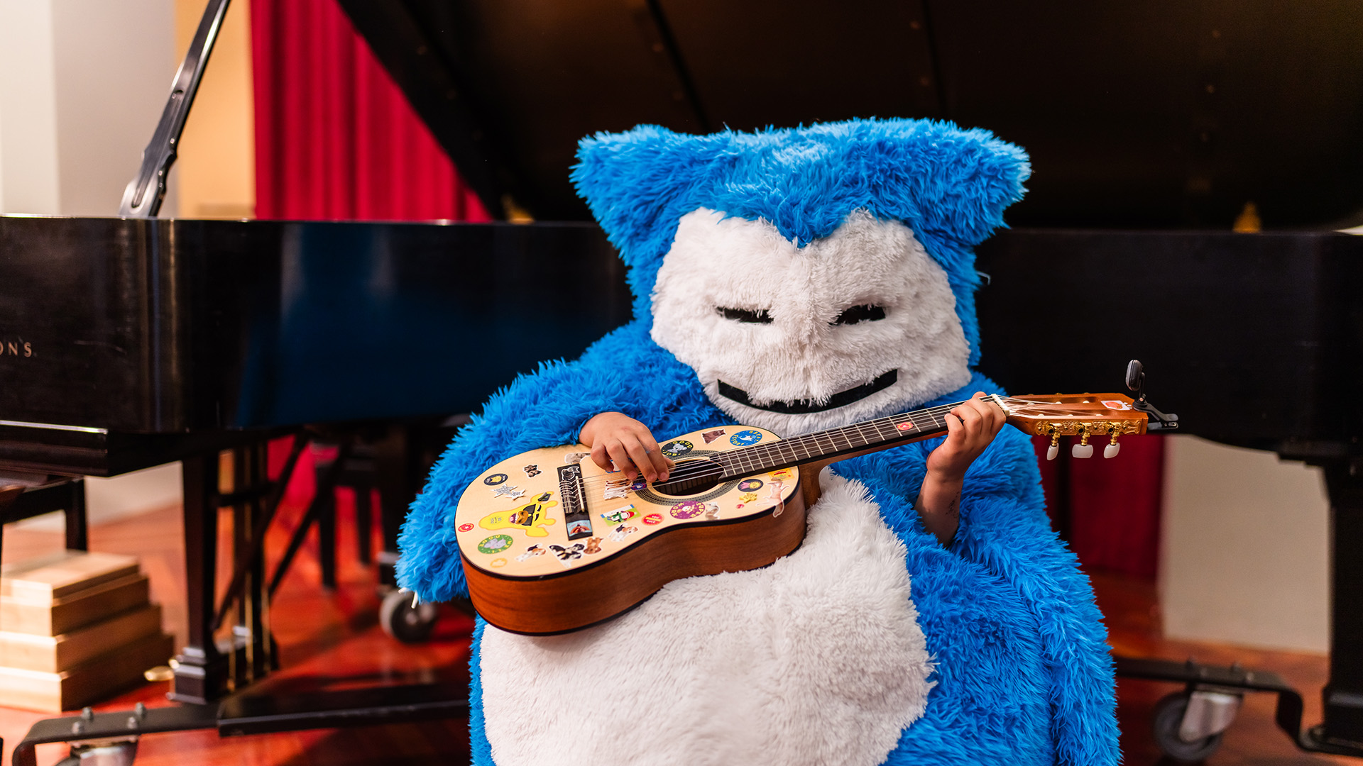 boo bash EVENT Suzuki Boo Bash, blue monster playing guitar