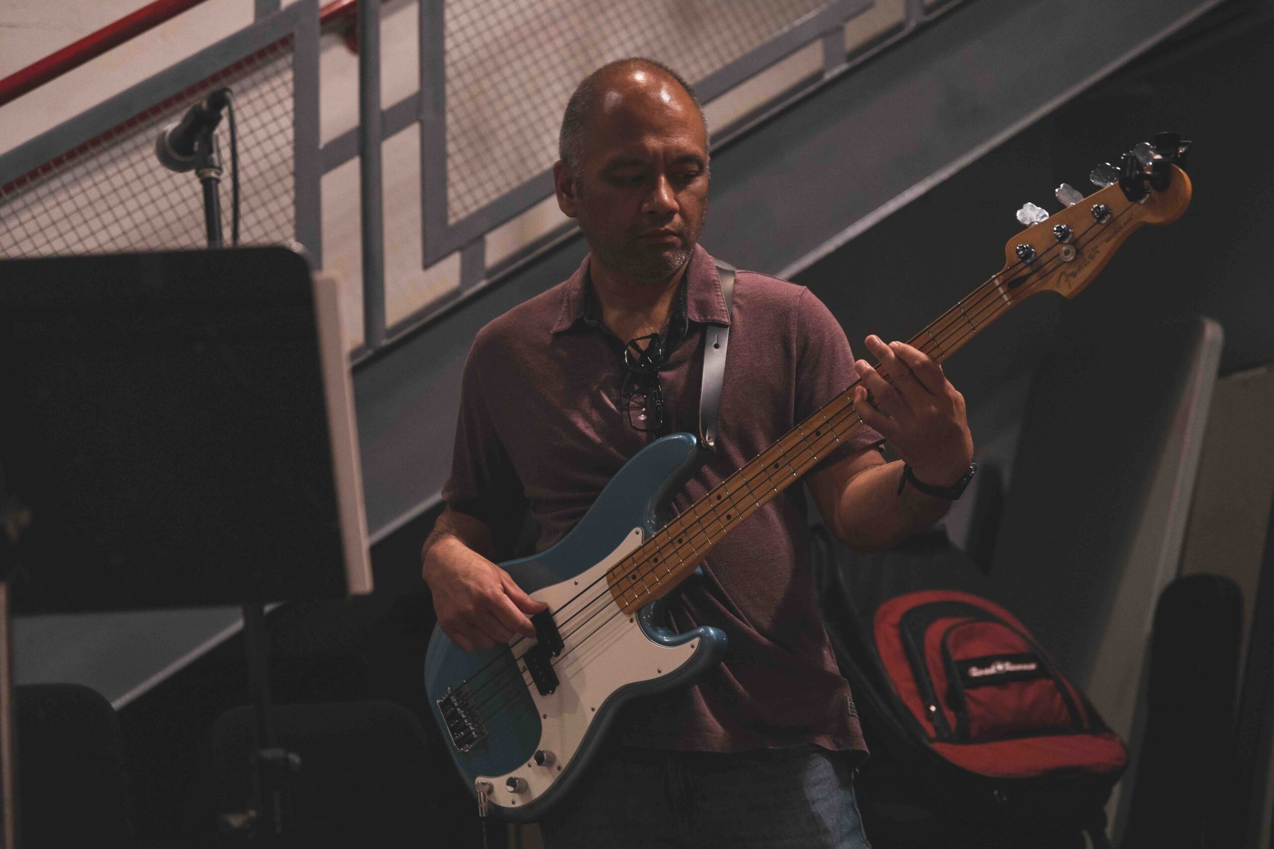 An electric bass student rehearsing in one of Levine's rock bands.