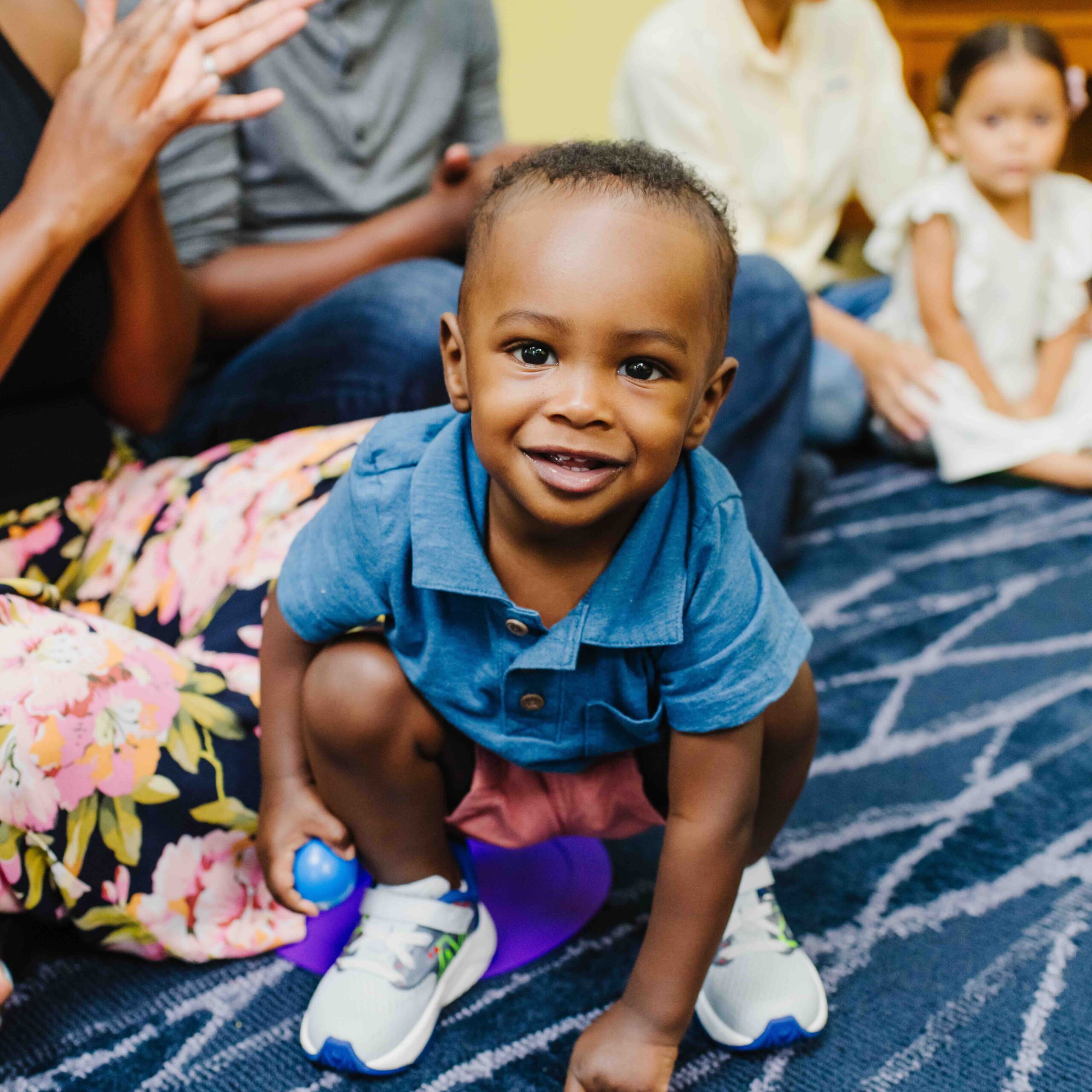A student enjoying a First Music class.
