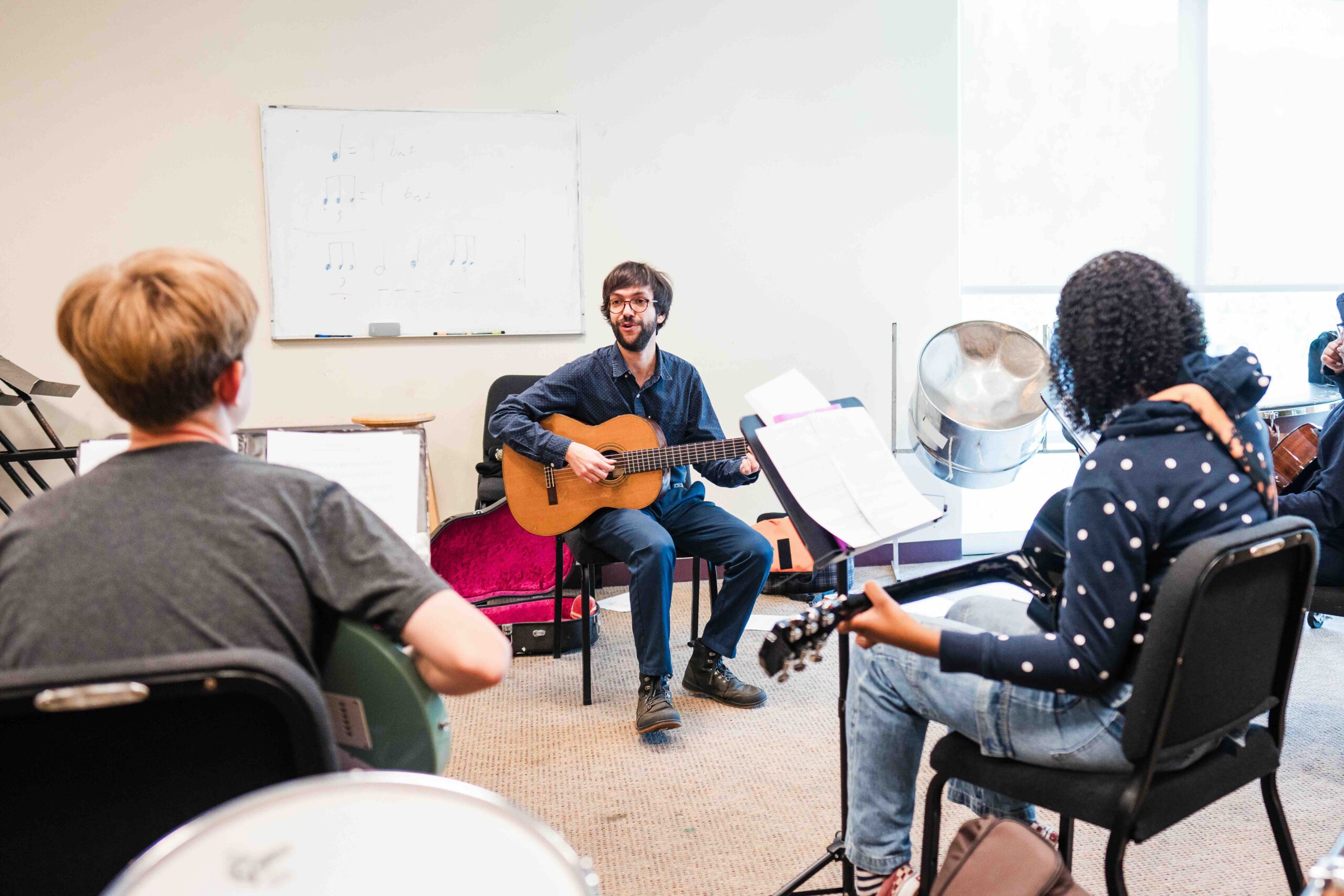 A group guitar class at THEARC.