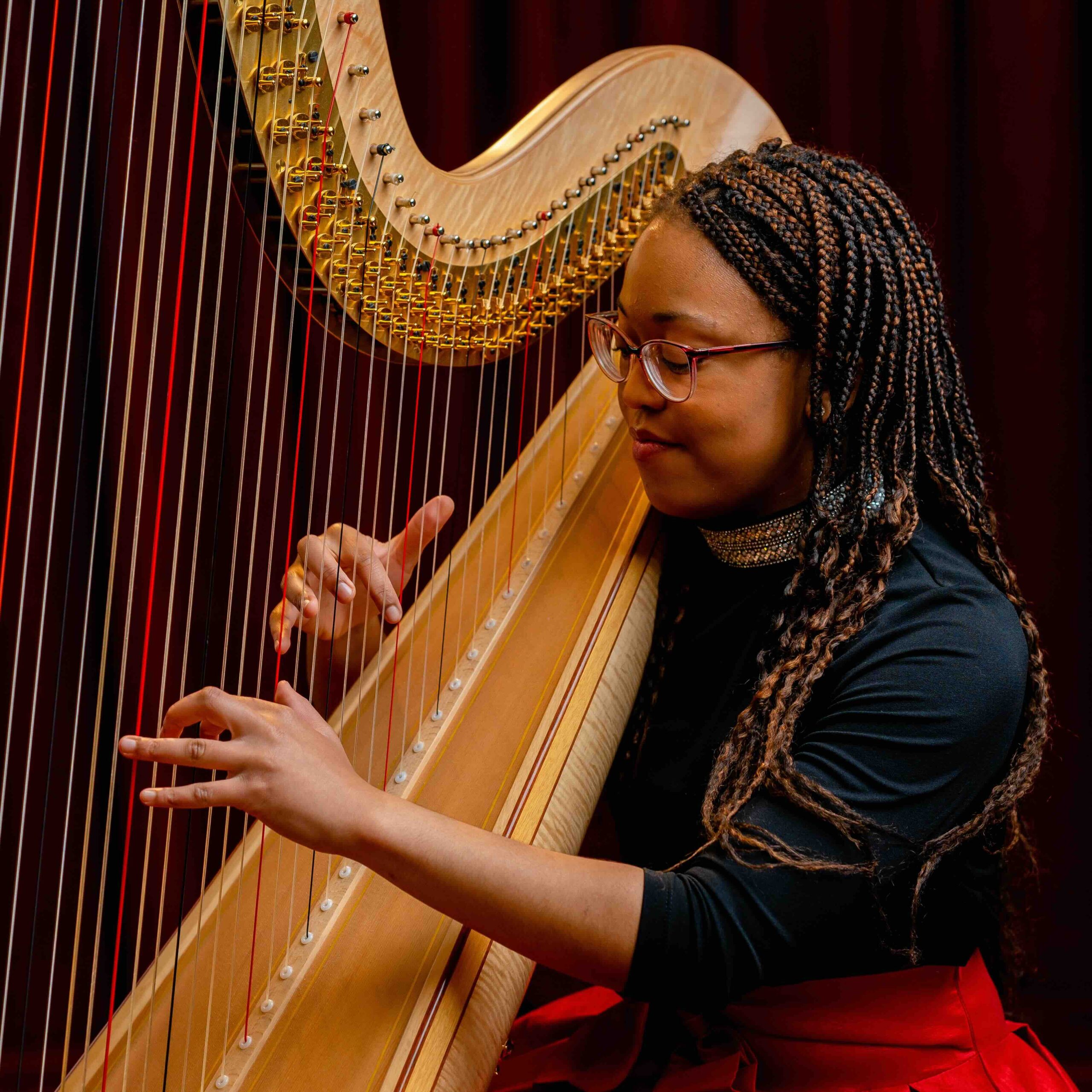 A harp student in performance.