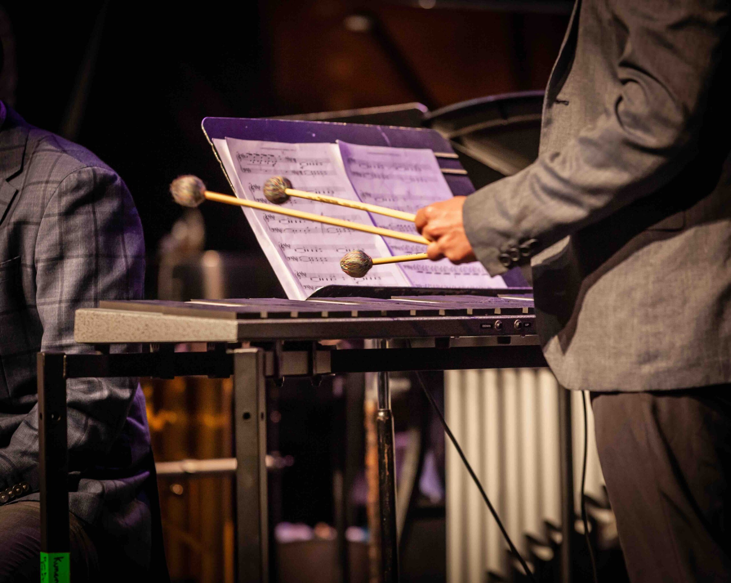 A percussionist playing an electric keyboard.