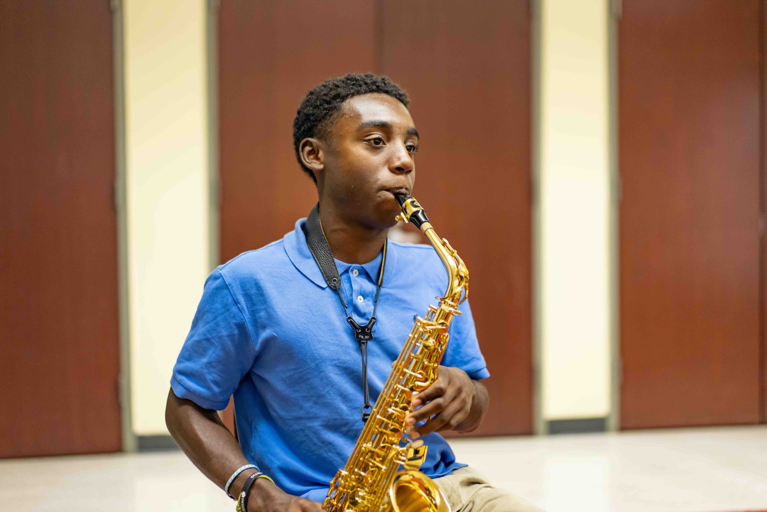 A saxophone student practicing at our Northwest campus.