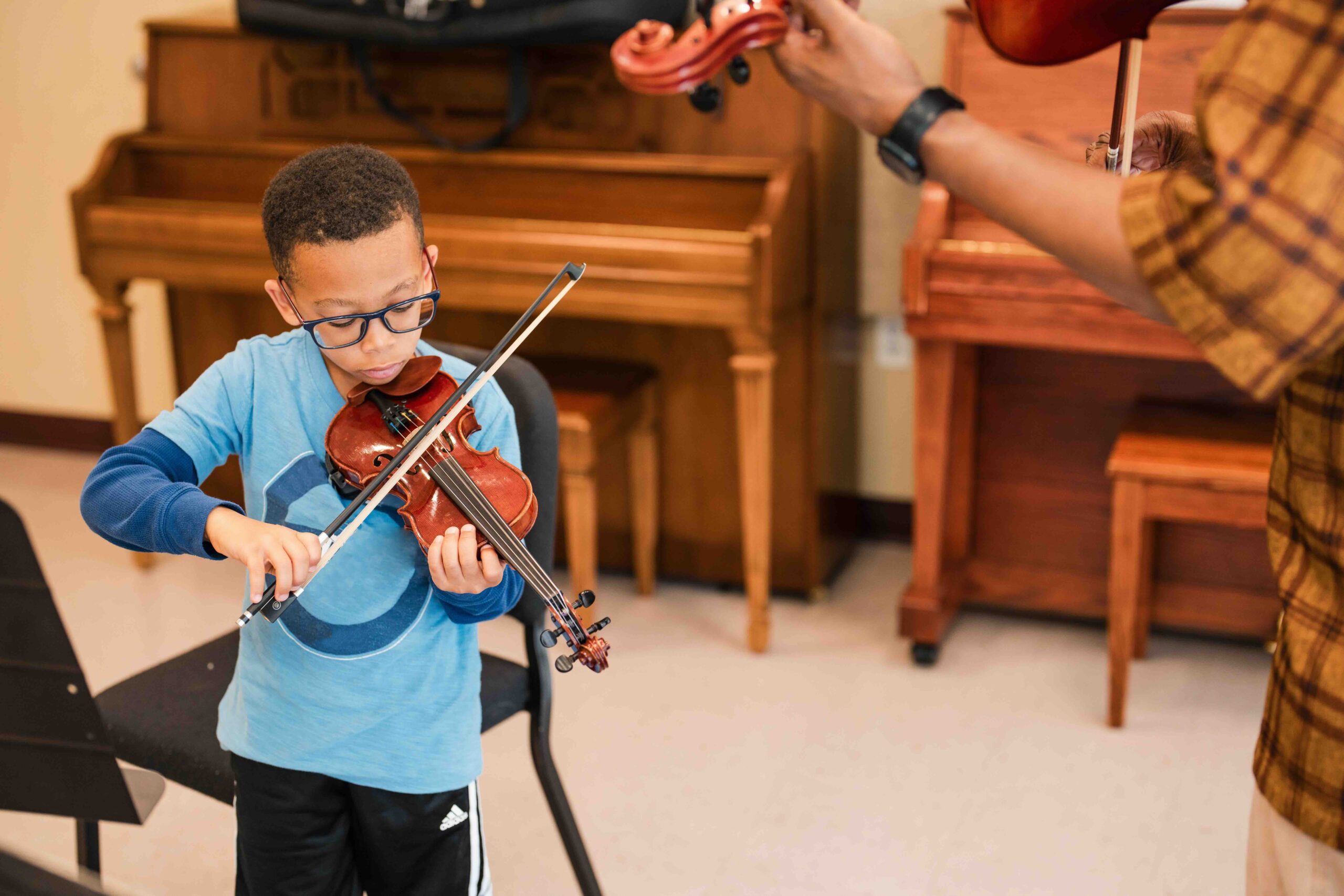 A violin lesson at THEARC.