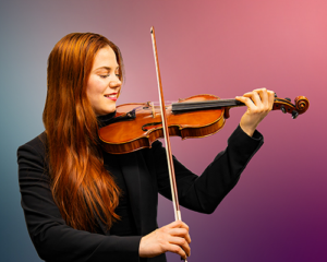 Image of Holly Nelson holding a violin.