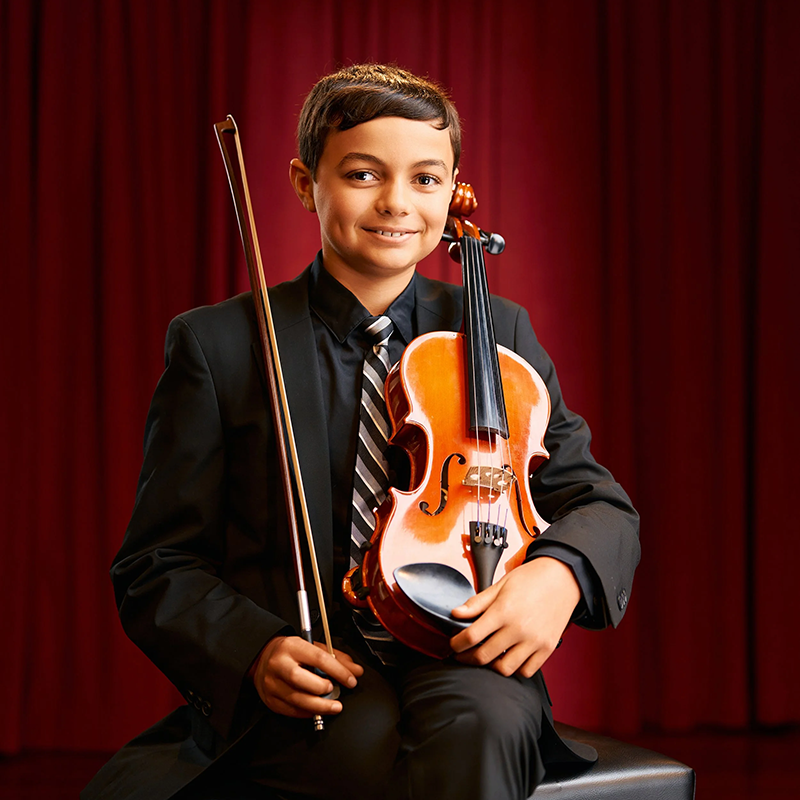 Photo of Philip Weeks seated holding a viola.